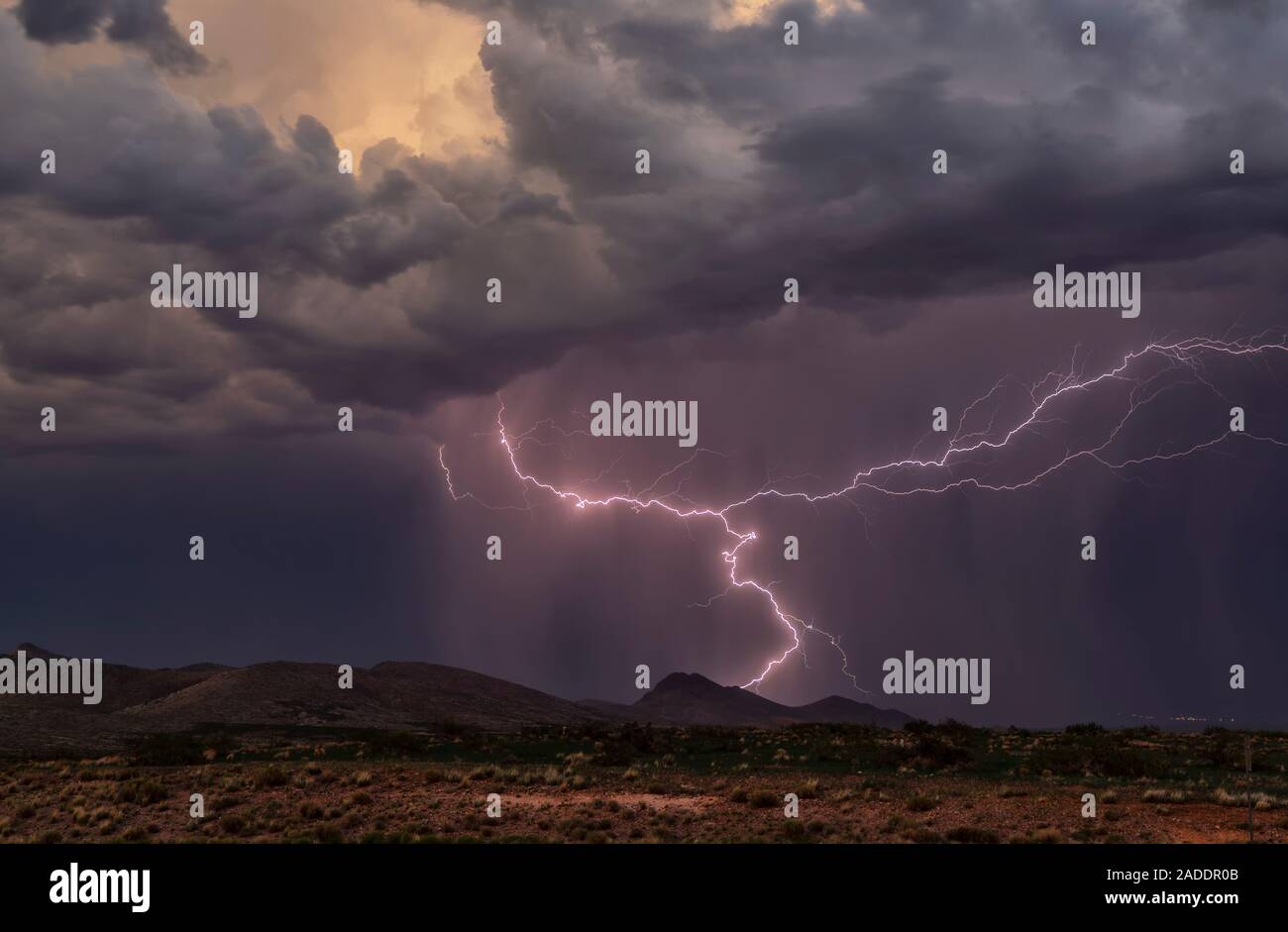 Lightning strike. Lightning strike during a thunderstorm at dusk ...