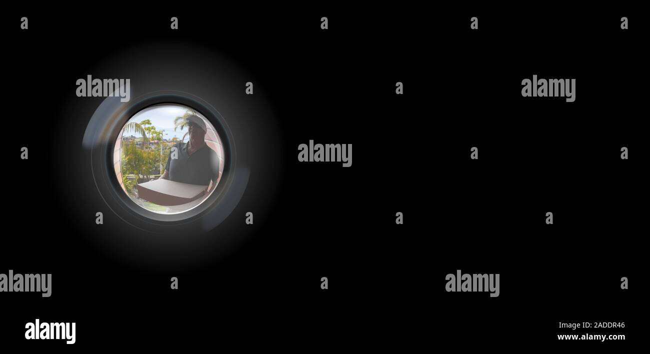 Peephole View of parcel delivery man outside door to entry security surveillance concept solid black background Stock Photo