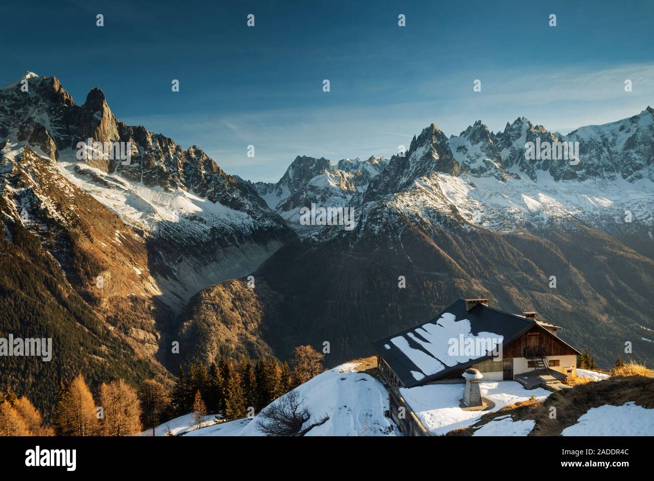 Cabin On A Mountain Top In Winter At Sunset Stock Photo 335291052