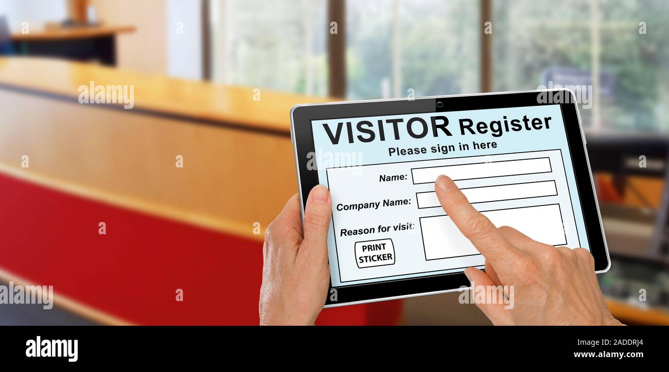 Visitor completing a sign in register form on computer tablet registration technology concept Stock Photo