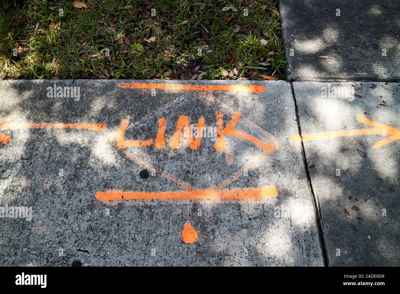 spray painted markings laying out underground cable tracks city of orlando florida usa Stock Photo