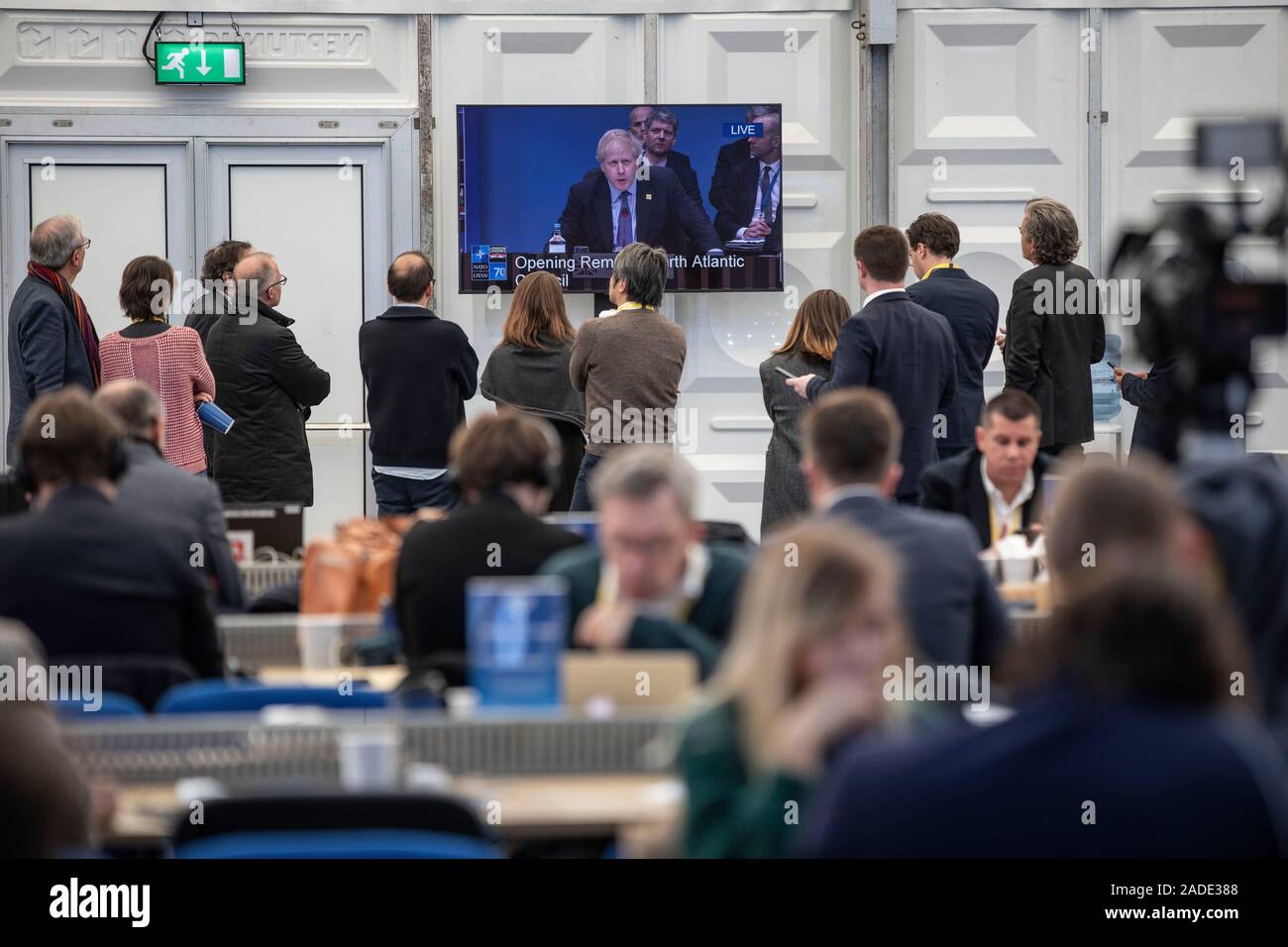 Journalists listen to The UK Prime Minister making his opening speech at The Grove in Watford for the start of the NATO Summit meeting as some of the most powerful world leaders will come together today. Credit: Jeff Gilbert/Alamy Live News Stock Photo
