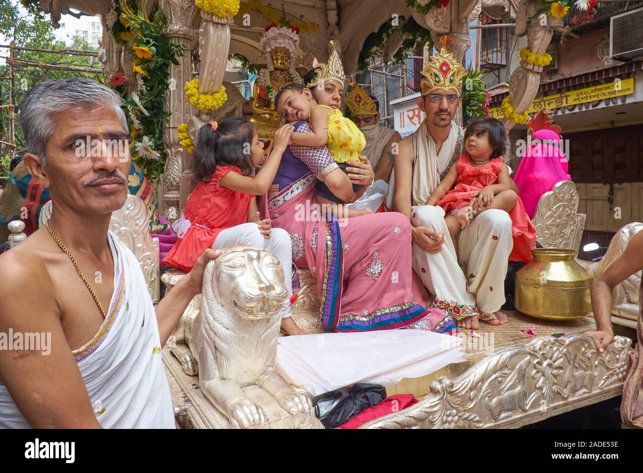 On Occasion Of A Jain Festival A Head Of The Jain Community And His Family Seated On A Chariot Are Pulled Through The Streets Of Mumbai India Stock Photo Alamy