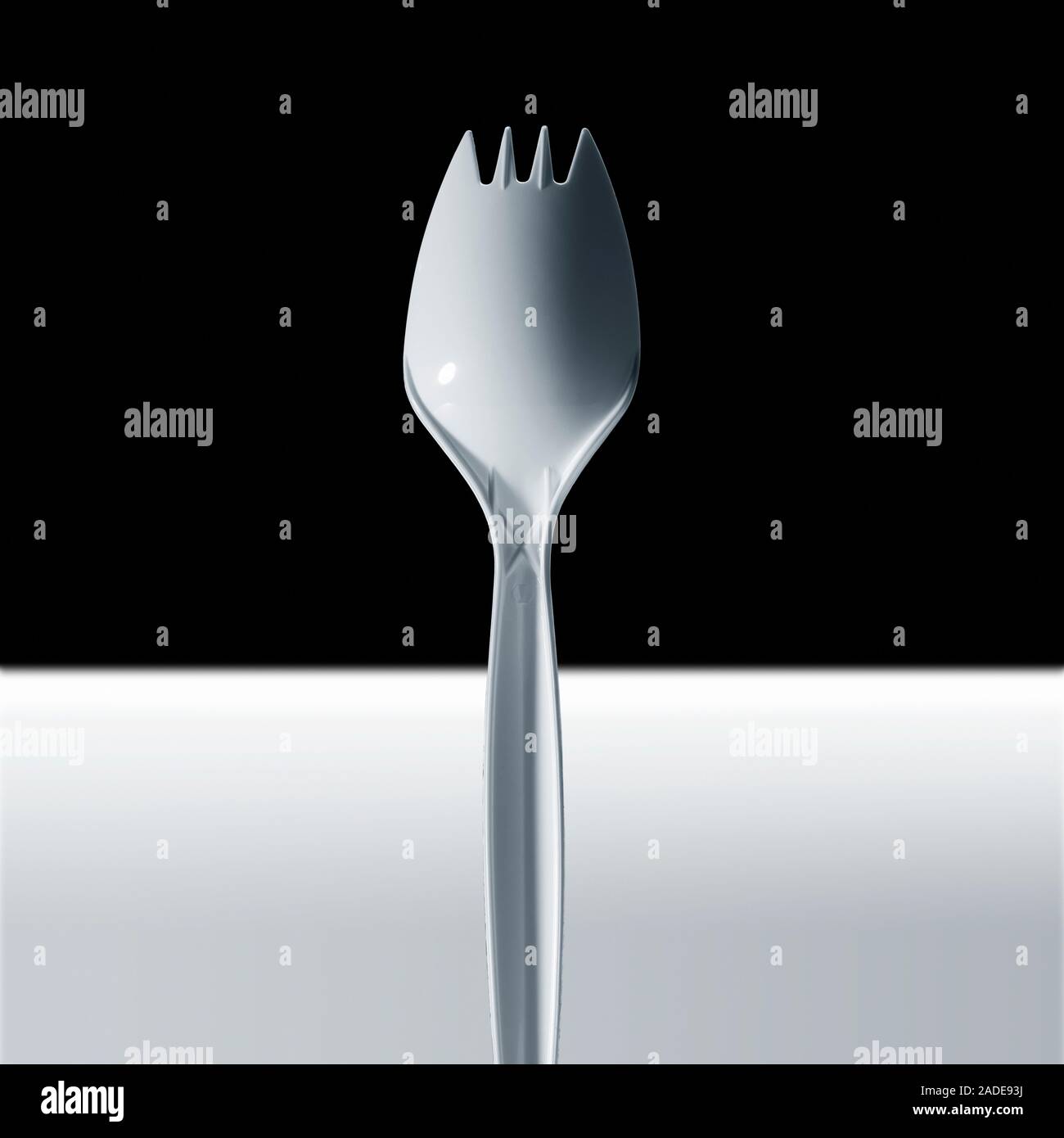Cropped image of disposable plastic fork. Stock Photo