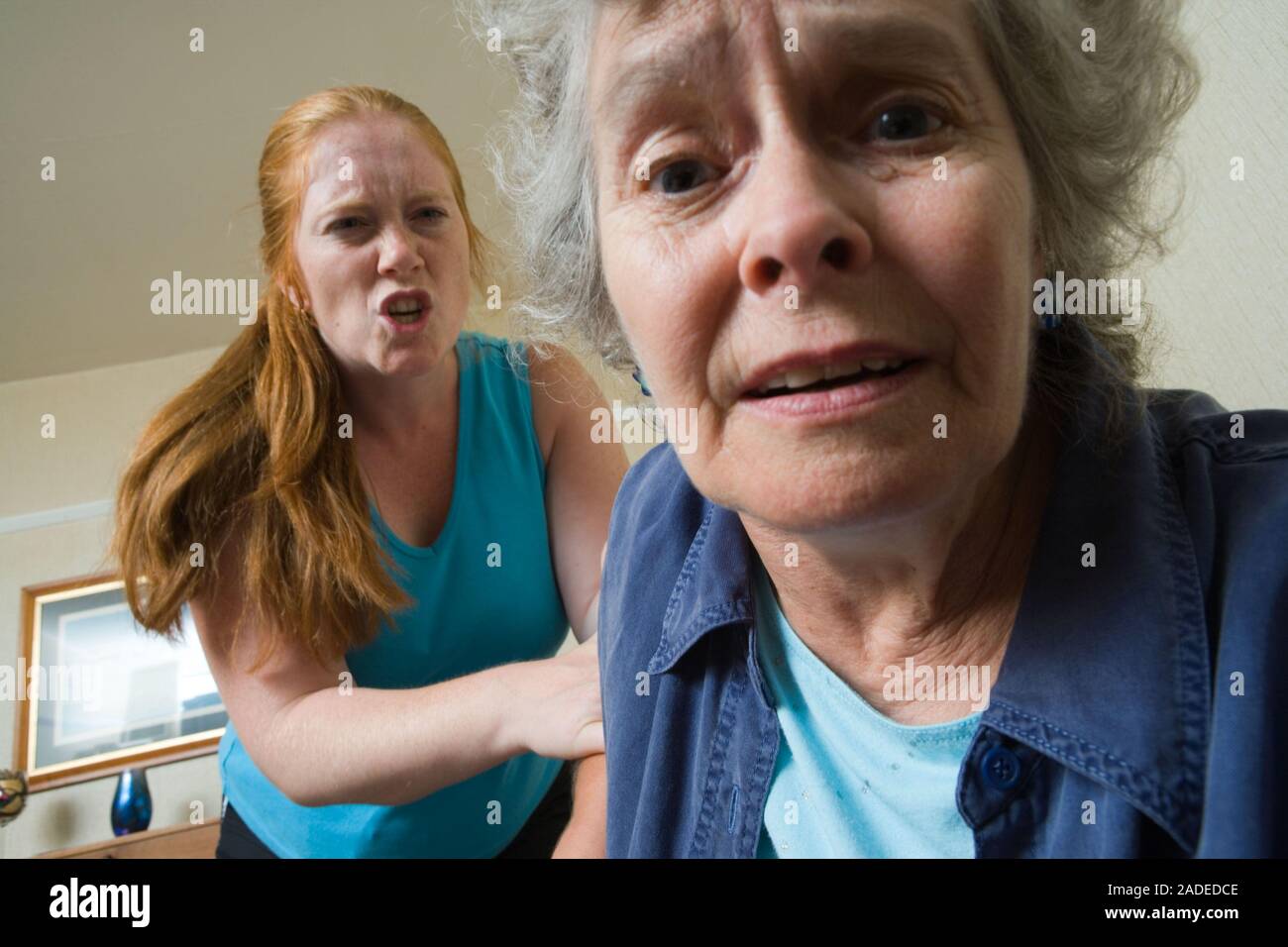 Young woman verbally abusing older person Stock Photo - Alamy