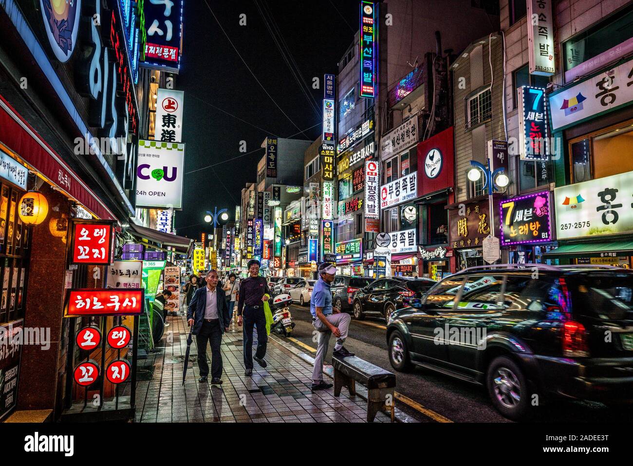 Busan Korea, 1 October 2019 : Busan busy street at night with people traffic and illuminated restaurants and shops signs in Busan South Korea Stock Photo