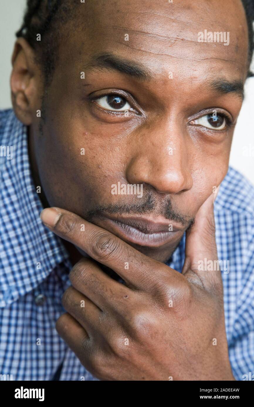 Young man looking thoughtful. Stock Photo