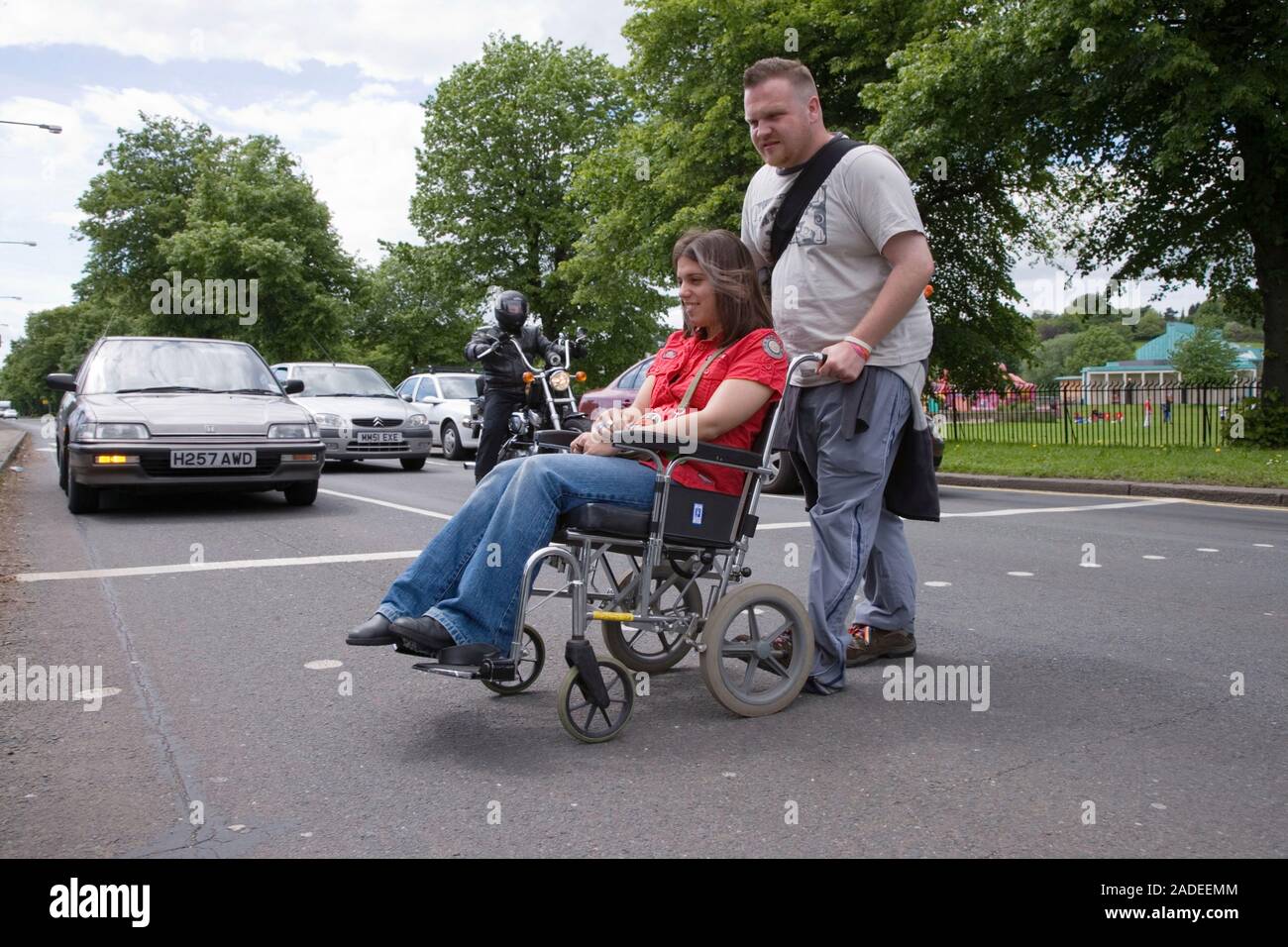 Young woman with cerebral palsy in a wheelchair with her boyfriend ...
