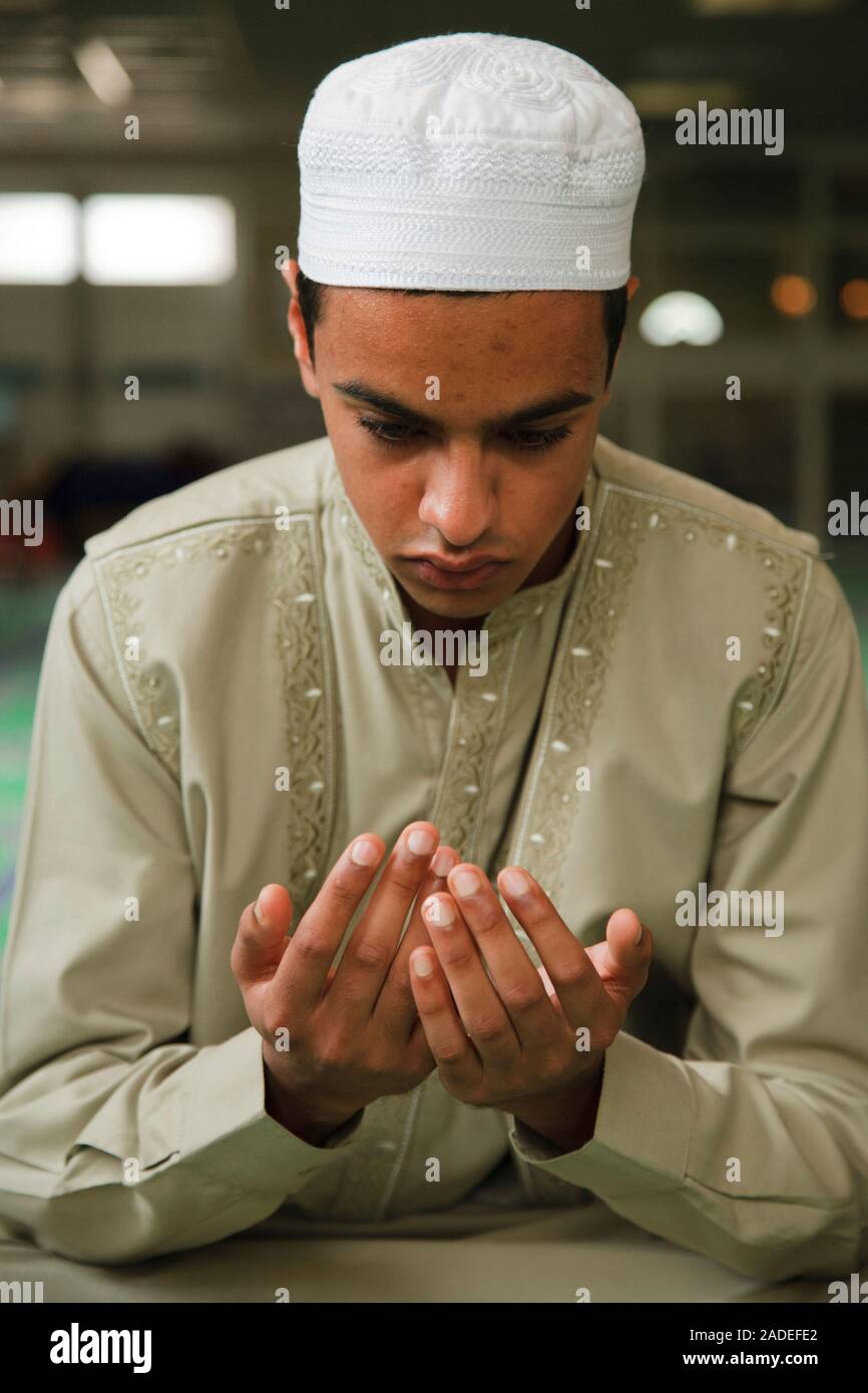 muslim-boy-asking-for-a-blessing-in-a-mosque-stock-photo-alamy