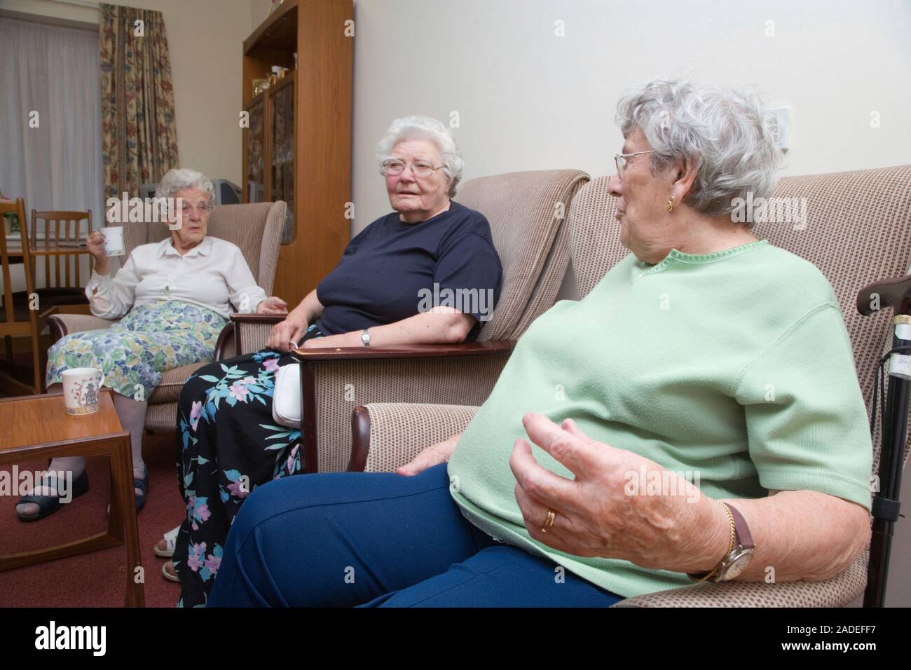 A group of older ladies enjoying a coffee morning in the communal