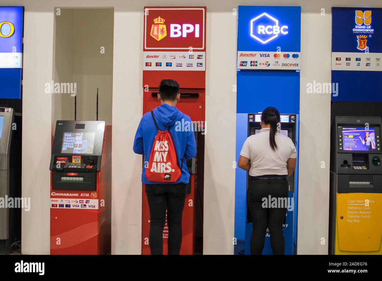 NOV. 28, 2019-BAGUIO CITY PHILIPPINES : People in line taking a widrawal at the atm machine. Stock Photo
