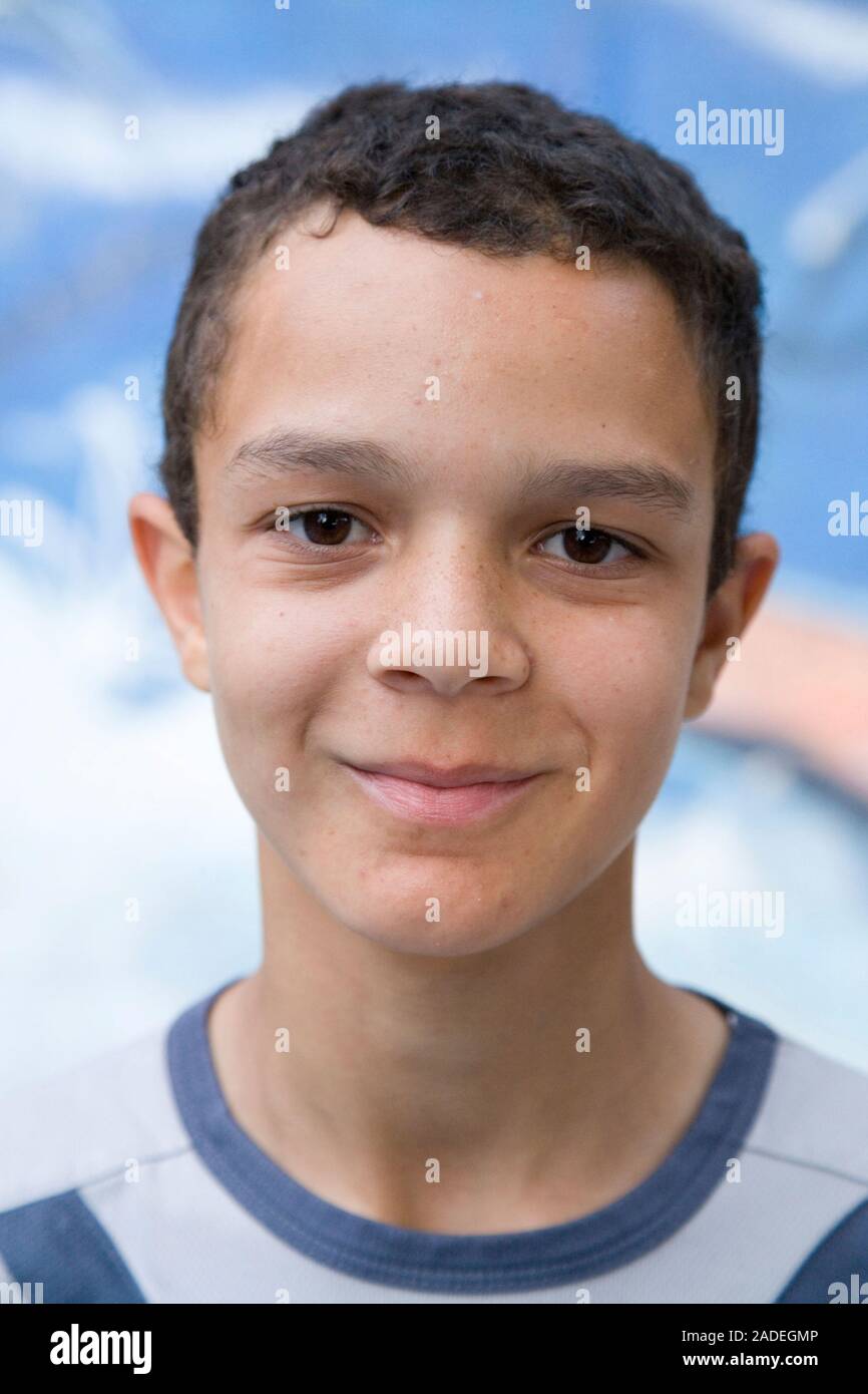 Portrait of teenage boy smiling Stock Photo - Alamy