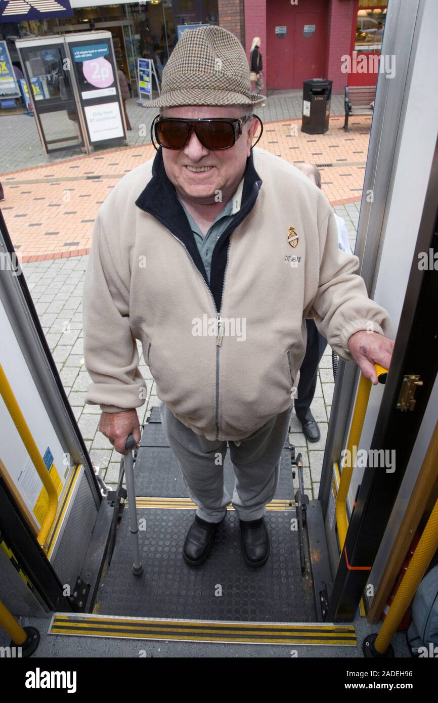 Man using platform lift to access mobile resource unit. Stock Photo