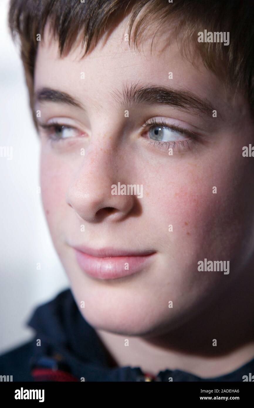 Portrait of a teenage boy smiling Stock Photo - Alamy