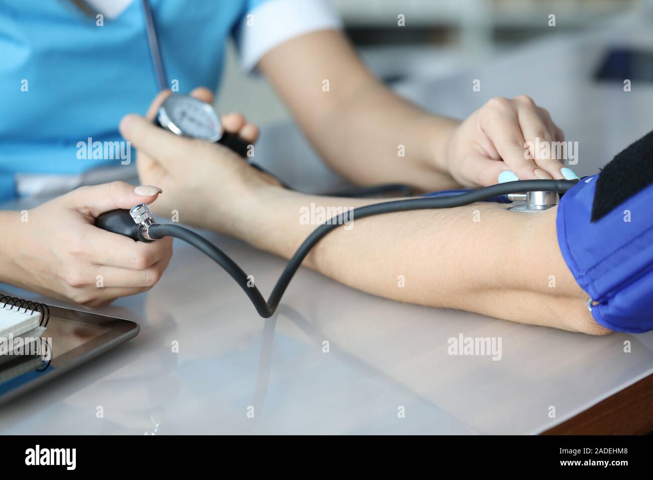 Doctor measuring pressure Stock Photo Alamy