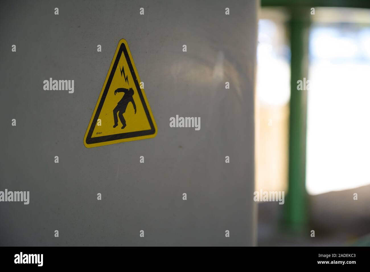 Danger of electric shock sign in an hidden place of Bastille Harbor, Paris, Fance. Closeup with shallow depth of field. Stock Photo