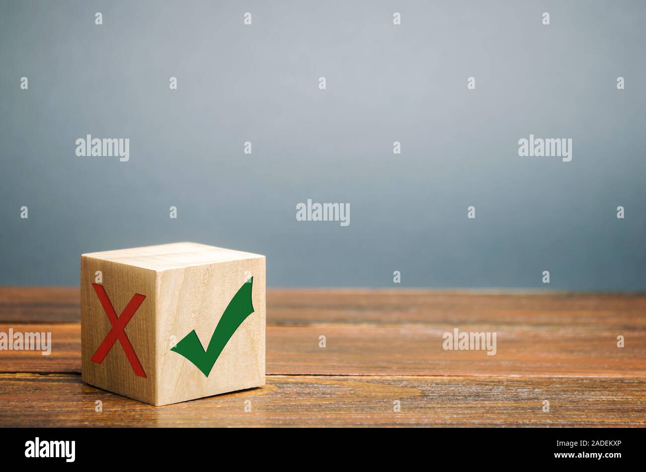 Wooden block with a green check mark. The concept of choice and making the right decision. Business management. Plan, planning. Referendum Stock Photo