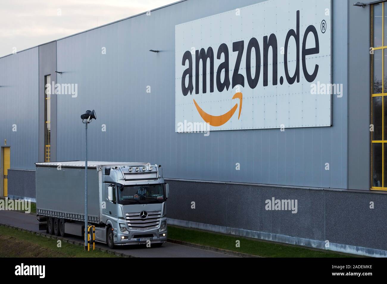 Trucks in front of Amazon logistics centre, Rheinberg, North Rhine-Westphalia, Germany Stock Photo