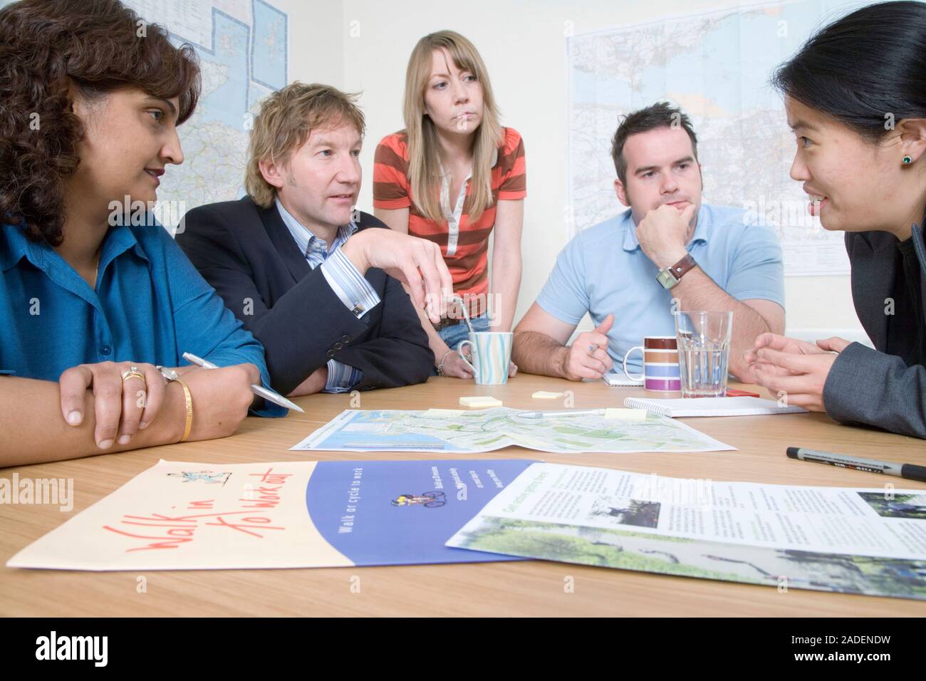 Community planning partnership group in discussion about sustainable transport routes. Stock Photo