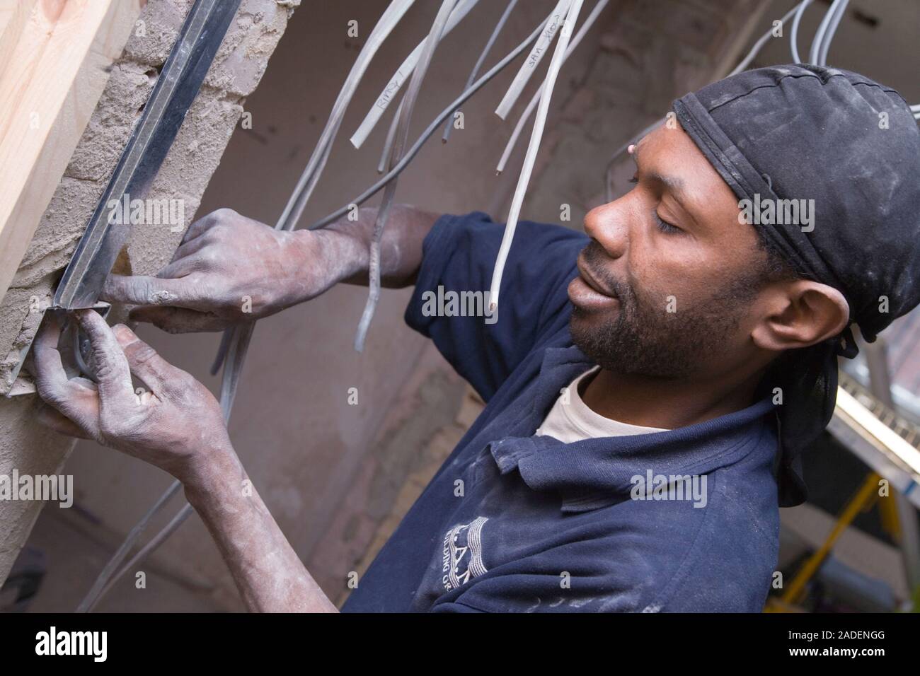 Electrician installing cables. Stock Photo