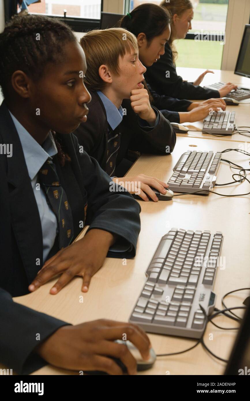 Secondary school students sitting at computers in an ICT lesson Stock Photo Alamy