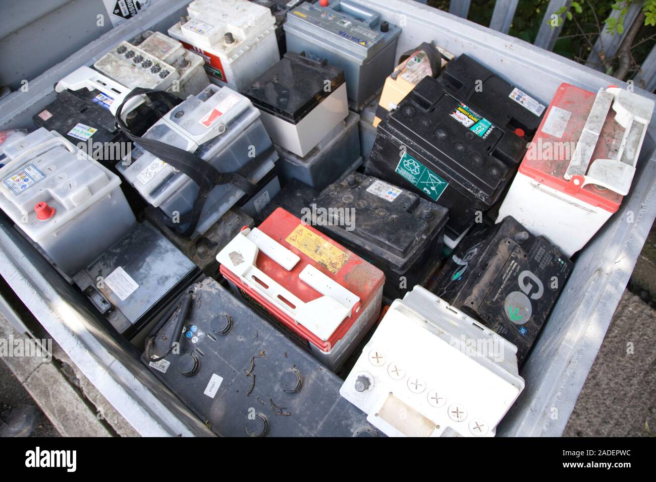 Old car batteries in bin at city tip Stock Photo Alamy