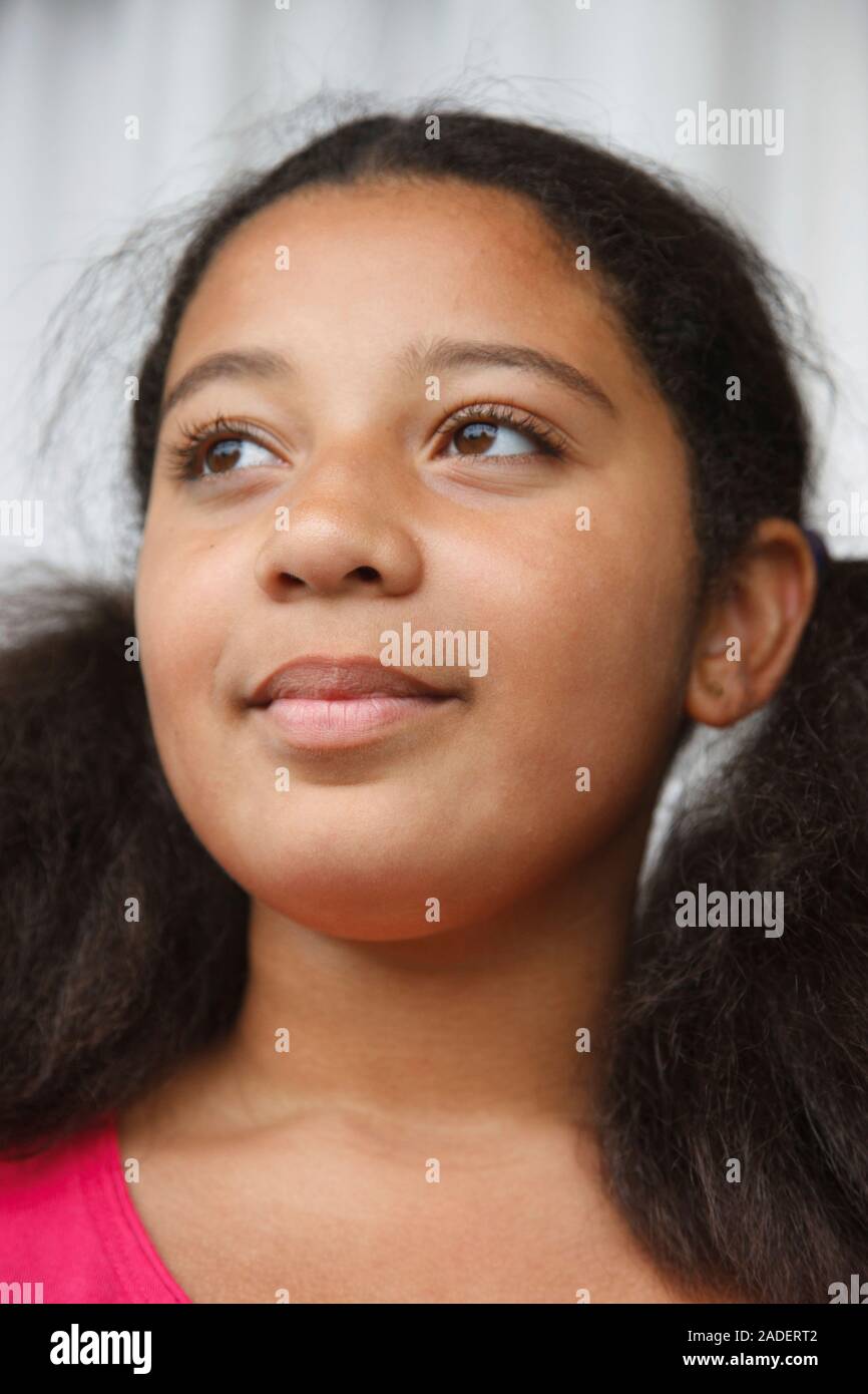 Portrait of mixed race girl looking thoughtful Stock Photo Alamy
