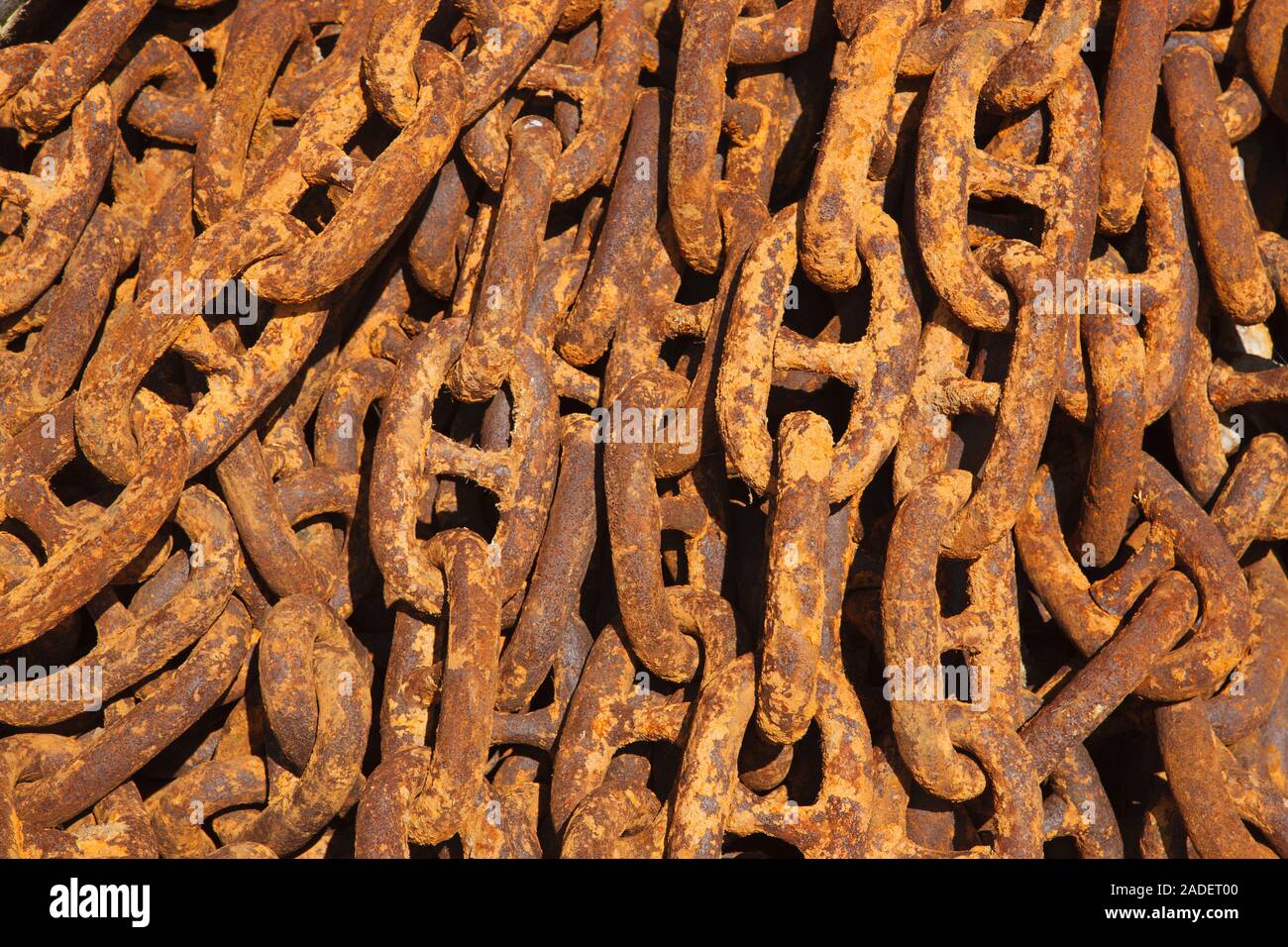 Rusty chain on quayside. Stock Photo