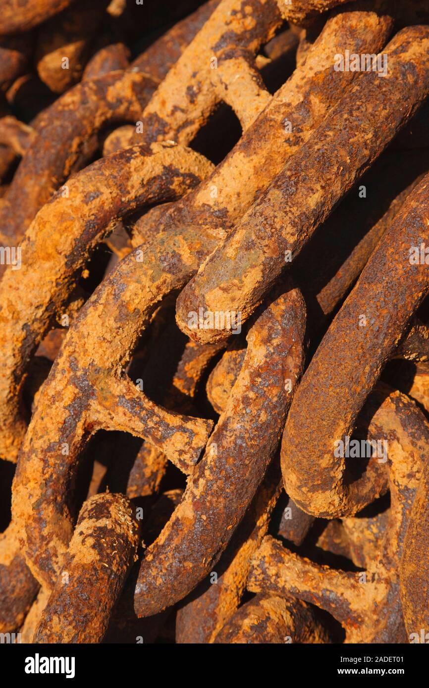 Rusty chain on quayside. Stock Photo