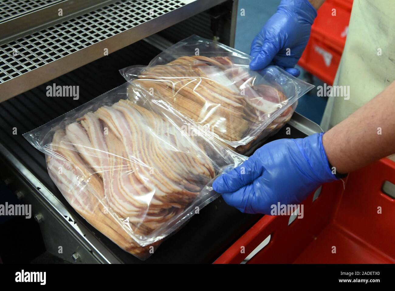 Usseln, Germany. 03rd Dec, 2019. In the 'Upländer Feinkost Waldecker Fleischwaren Heinrich Saure GmbH' packaged bacon is shown. Saure has 30 employees and produces 80 tons of sausage and meat specialities per month. (zu dpa-Korr 'Wilke meat scandal: Consumers do not spoil their appetite') Credit: Uwe Zucchi/dpa/Alamy Live News Stock Photo