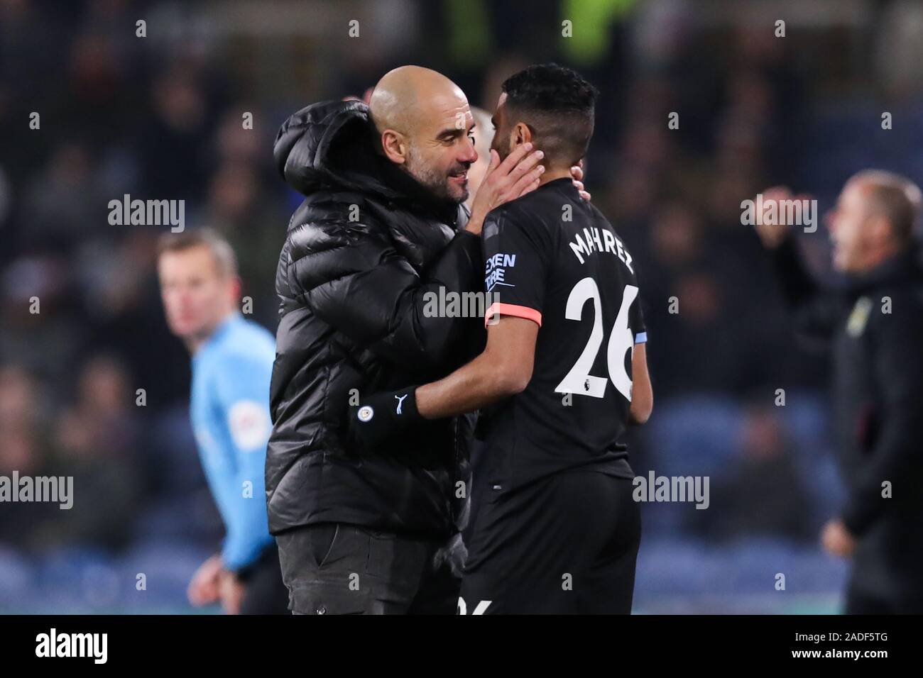 BURNLEY, ENGLAND - DECEMBER 03: Pep Guardiola of Manchester City kisses Riyad Mahrez during the Premier League match between Burnley FC and Manchester City at Turf Moor on December 3, 2019 in Burnley, United Kingdom. (Photo by MB Media) Stock Photo