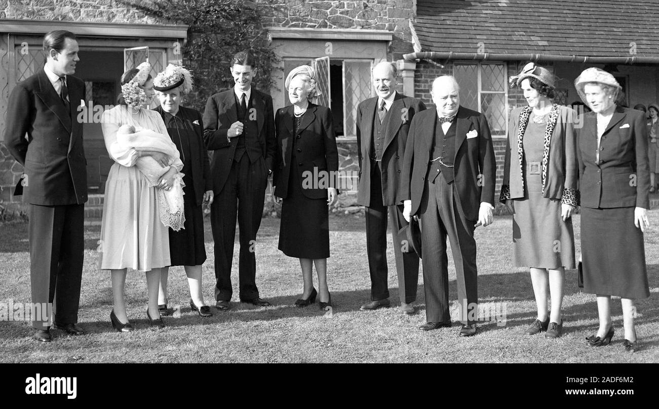 Mr and Mrs Winston Churchill were present at Westerham, Kent, for the christening of their fifth grandchild, Arthur Nicholas Winston Soames, first child of their daughter Mary. The christening party on the lawn at Westerham after the service (L-R) Captain Christopher Soames, Mary Soames with baby,Maryott White, Major Rufus Clarke, Captain Graham Soames (the baby's paternal grandfather) and Winston Churchill. Extreme right is The Hon. Mrs Charles Rhys. Stock Photo