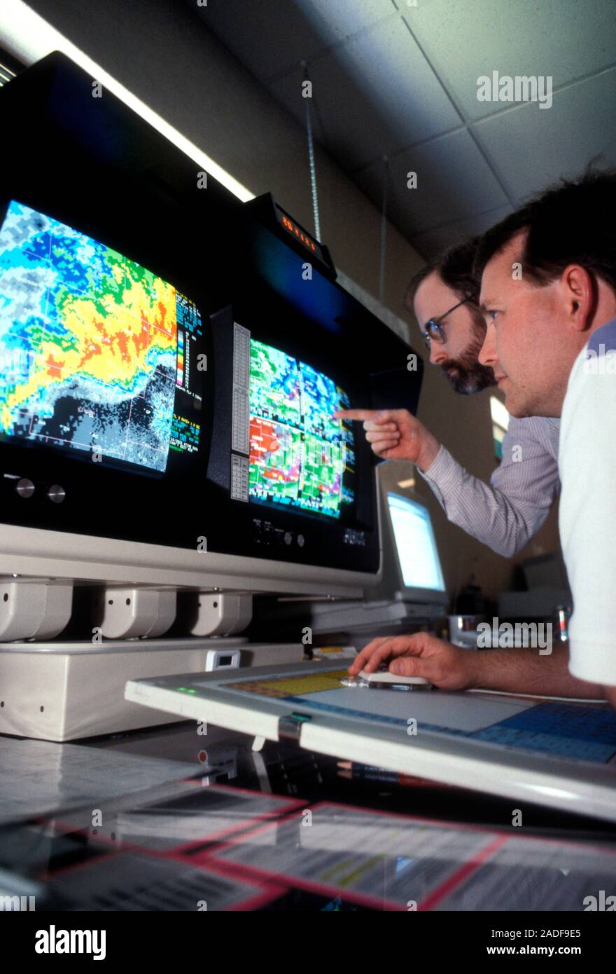 Weather forecasting. Meteorologists monitoring the progress of a severe ...