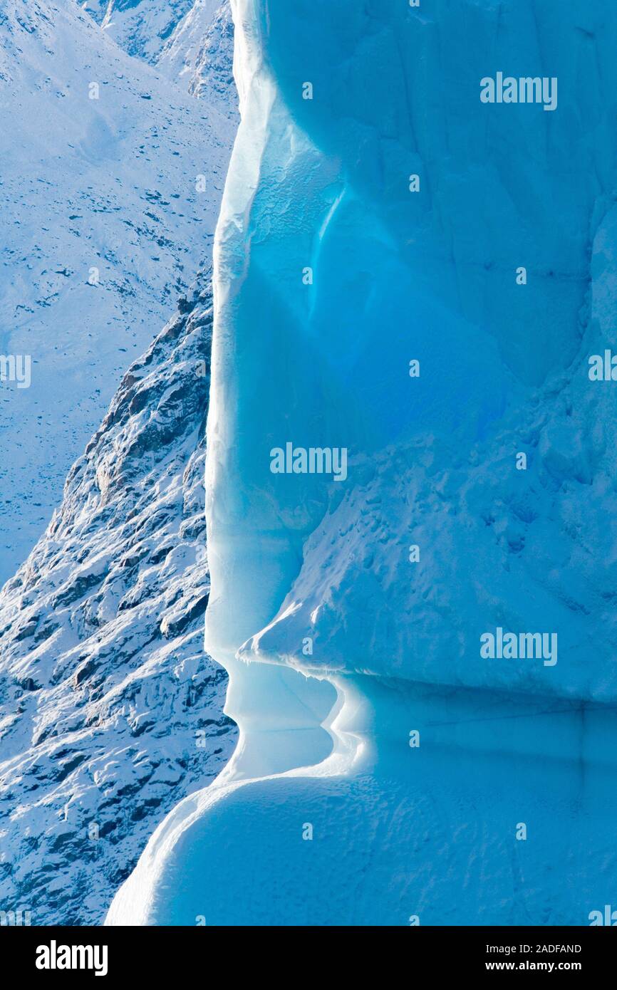 Eroded iceberg. Notch in an iceberg caused by wave erosion