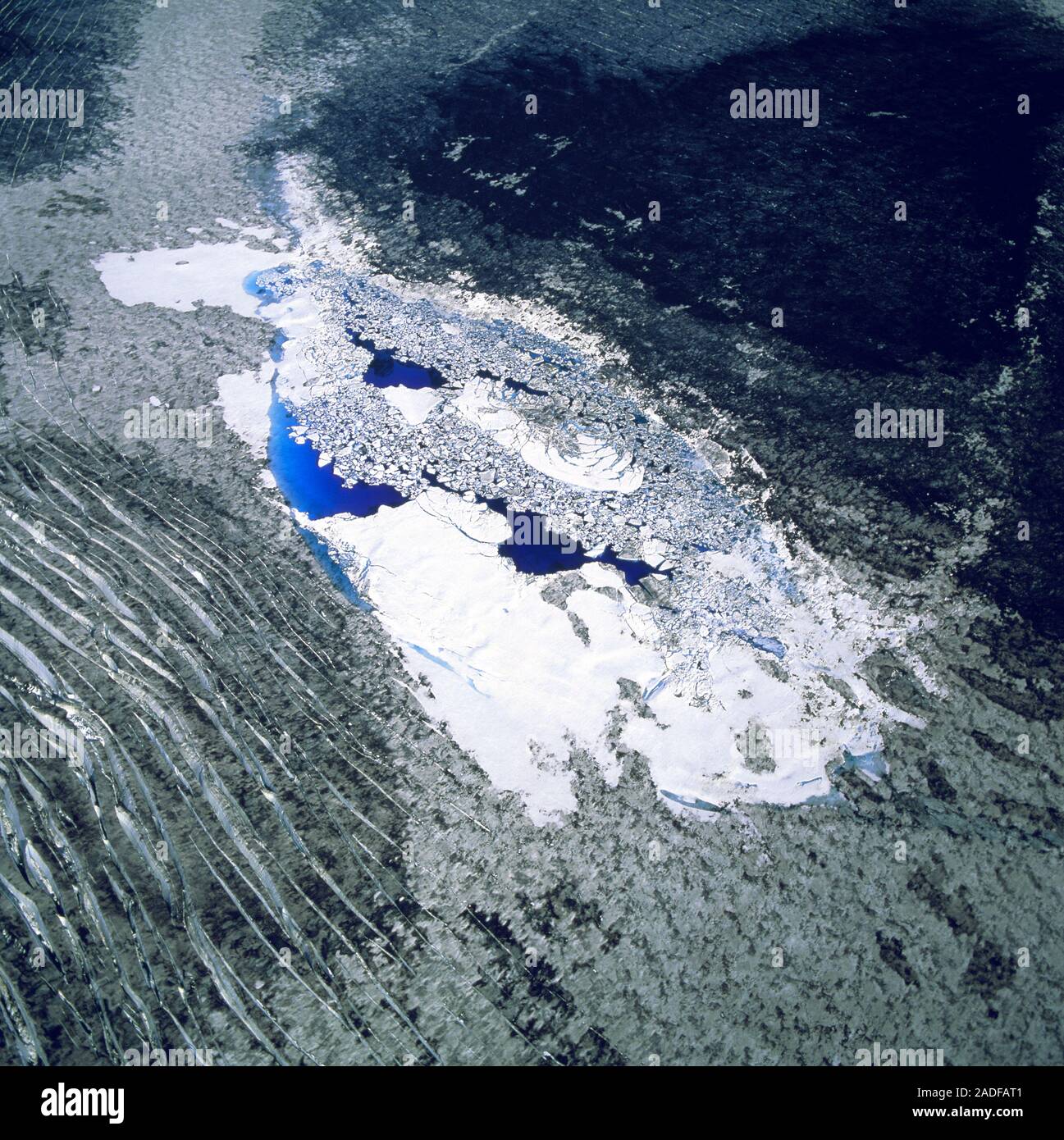 Melt water pond. Aerial view of a melt water pond on a glacier, formed