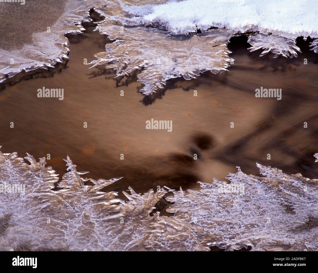 Frozen stream. Ice on the surface of a frozen stream. Photographed at ...