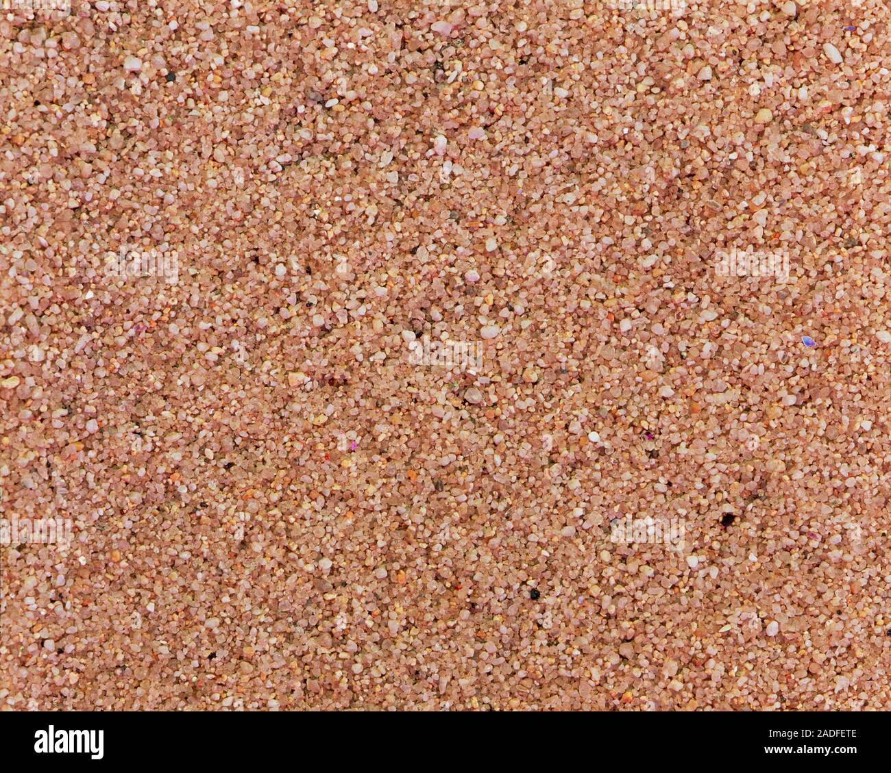 Sand. Sand is a loose granular substance resulting from the wearing down of arenaceous rock, a