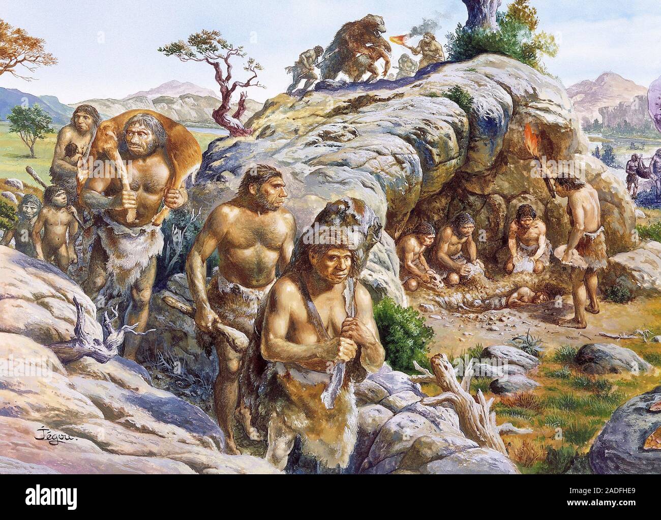 Neanderthal man. Artwork of a tribe of Homo neanderthalis near a rock ...