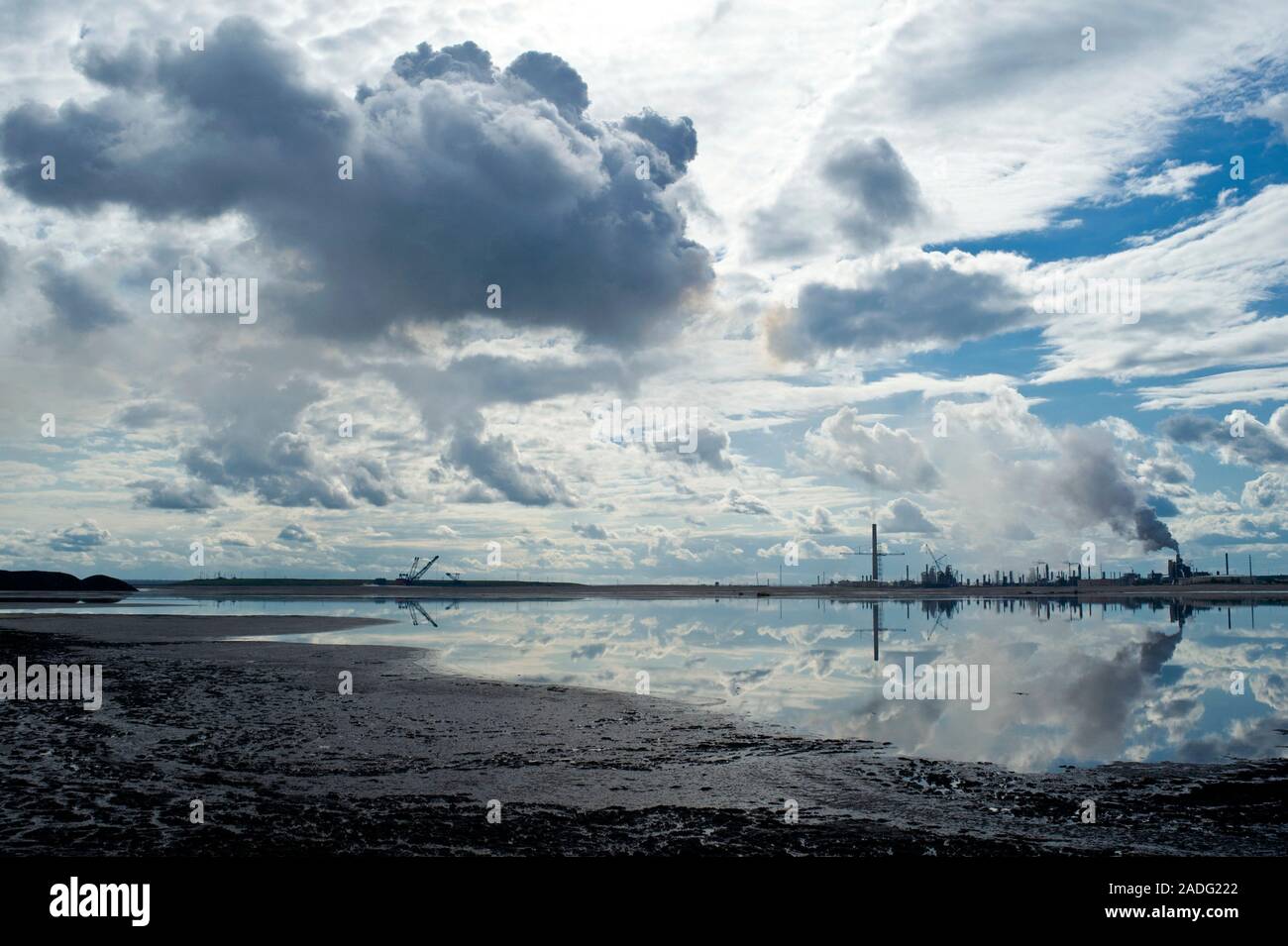 Oil industry pollution. Tailings settling pond with residual crude oil ...
