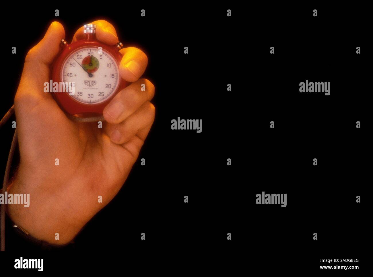 Stopwatch. Hand holding a stopwatch. This device is used to measure