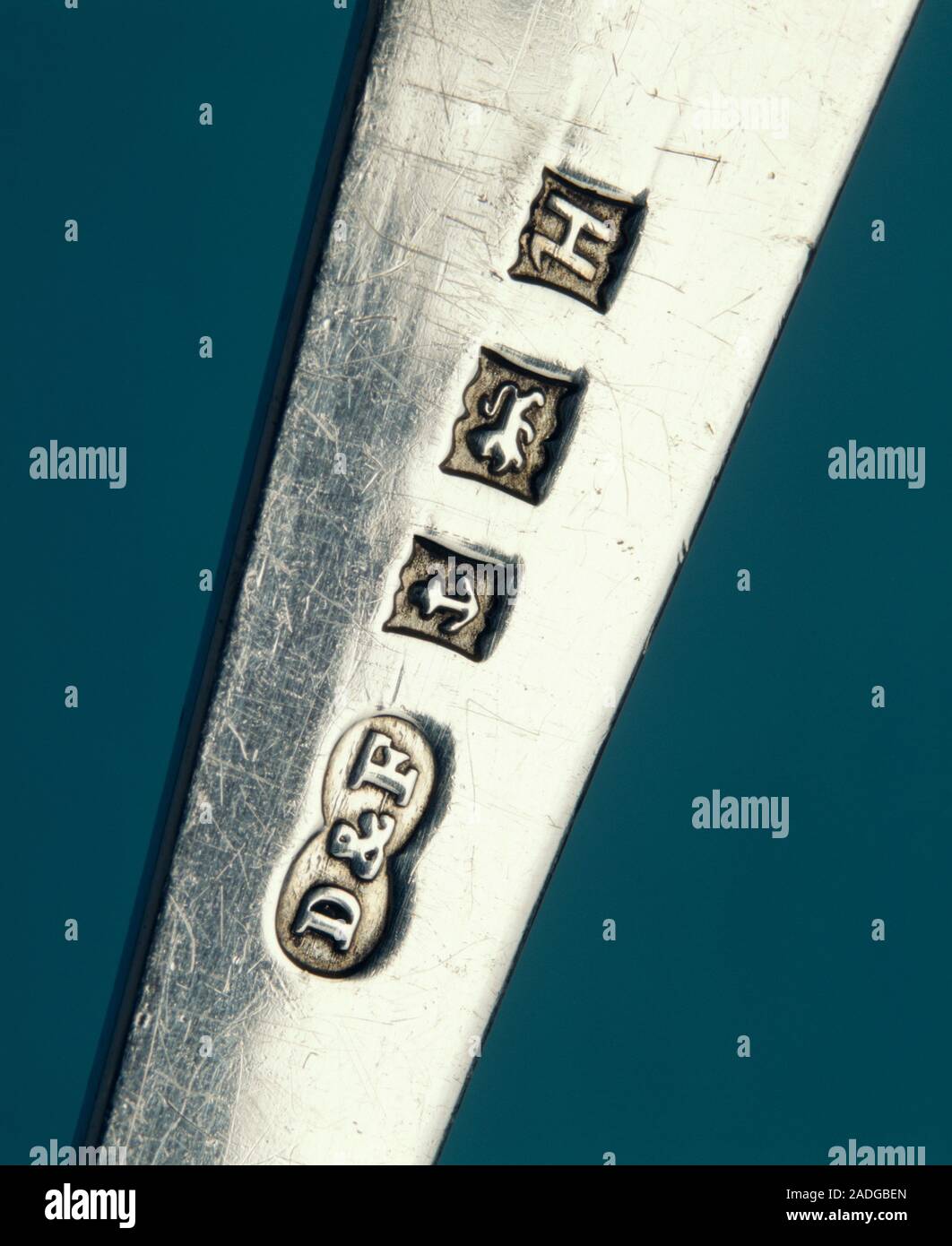 Silver hallmarks. Handle of a piece of silver cutlery showing assay