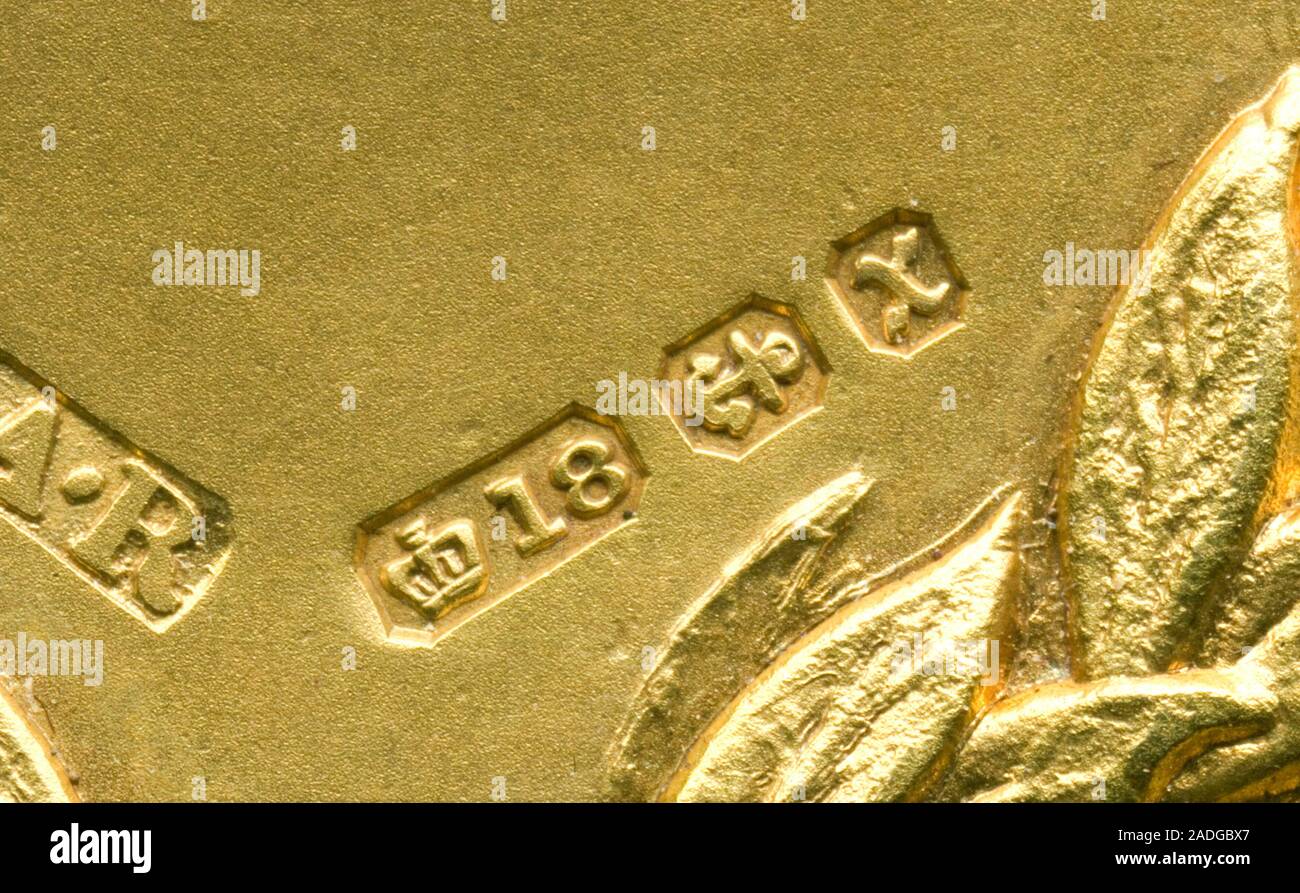 Gold hallmarks from 1897 on a gold medal. A hallmark is an official