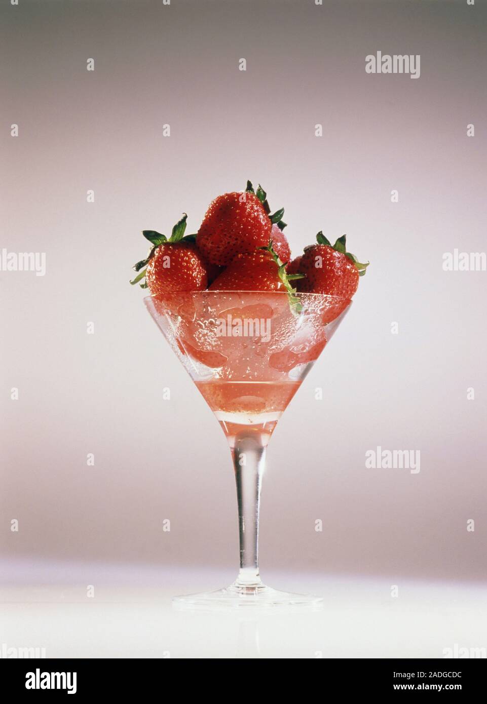 A glass containing ripe strawberries. Stock Photo