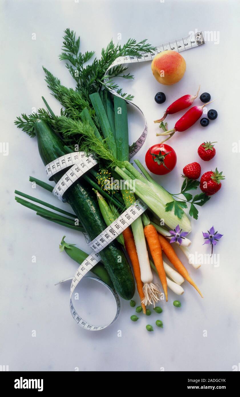 Healthy diet. View of a tape measure wrapped around a selection of