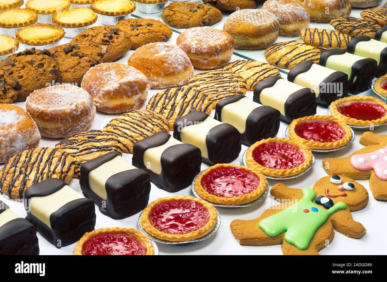 Unhealthy foods. Selection of unhealthy foods, including cakes