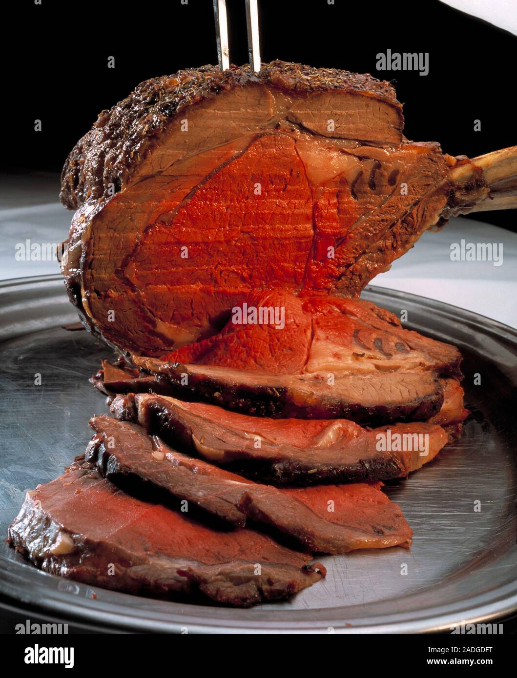 Roast beef. Sliced rib joint of roast beef Stock Photo - Alamy