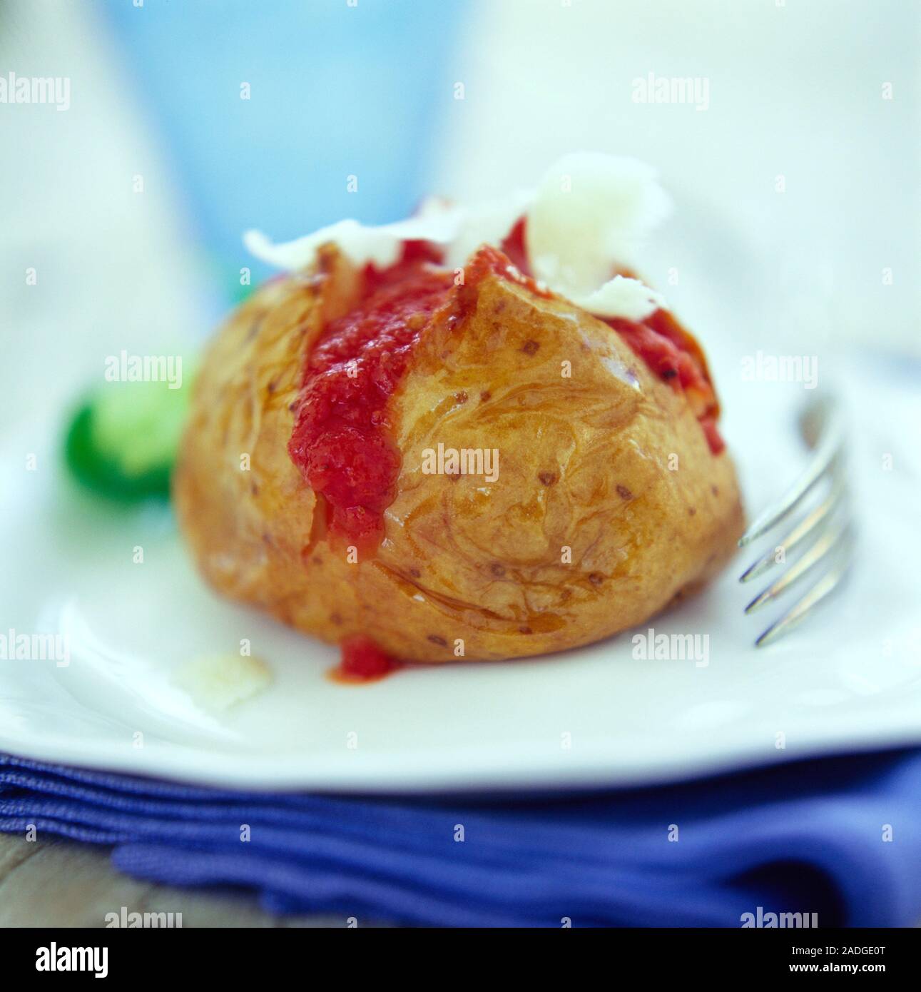 Filled jacket potato on a plate. Potatoes provide energy in the form of