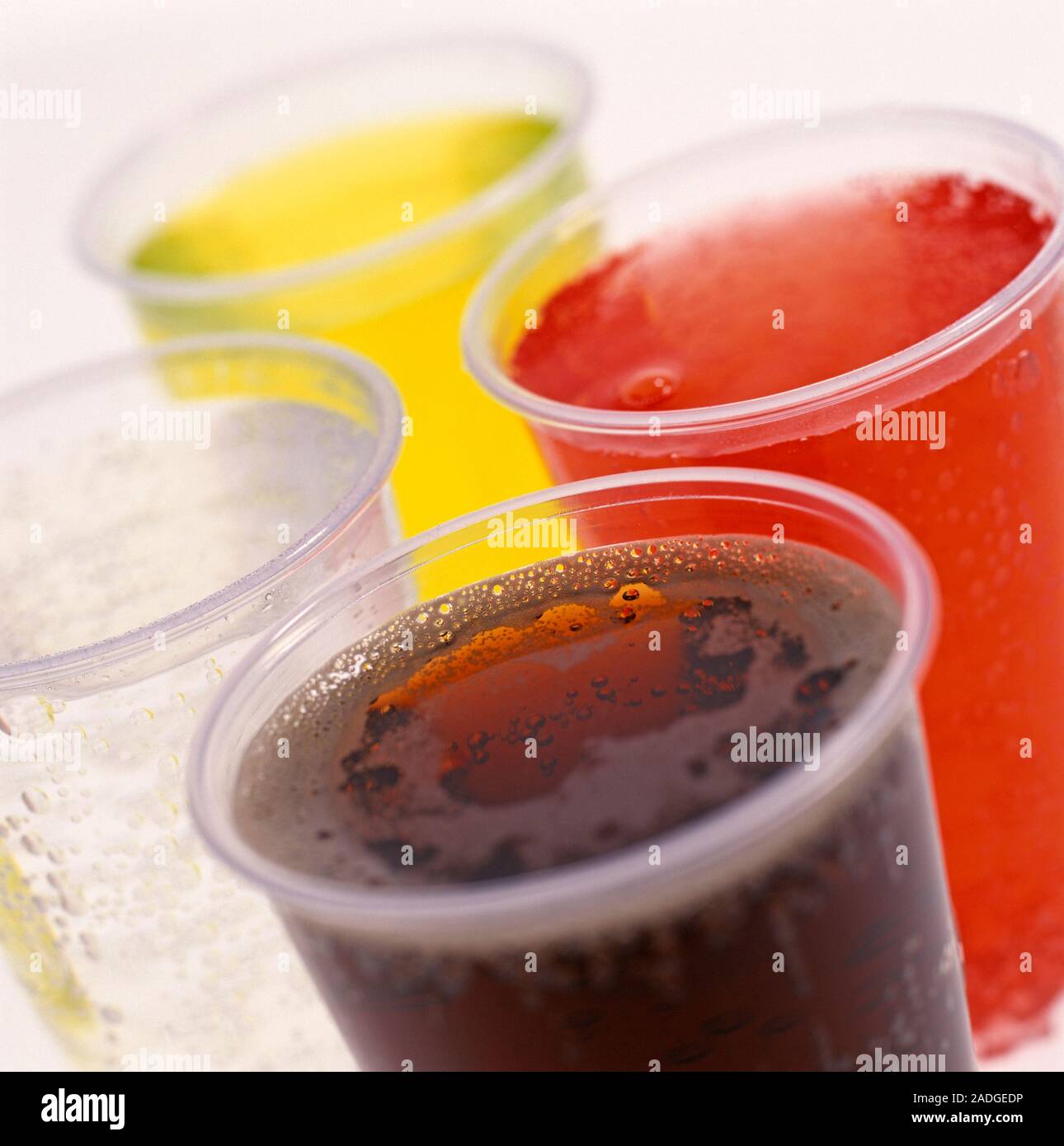Fizzy soft drinks. Glasses of carbonated soft drinks containing