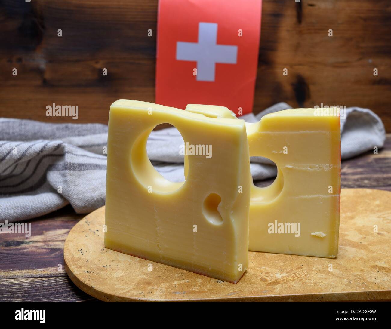 Cheese collection, swiss emmentaler cheese with big holes and flag of