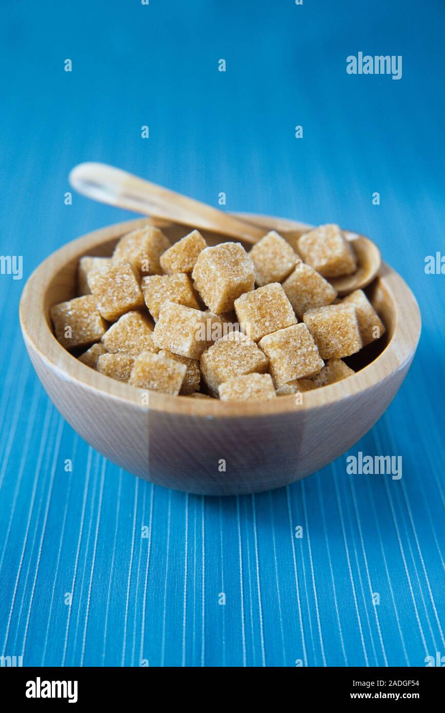 Brown sugar cubes in a bowl. Sugar is made from heated sugar cane and